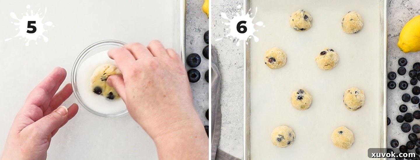 Rolling the cookie dough balls in extra sugar for a beautiful crust.