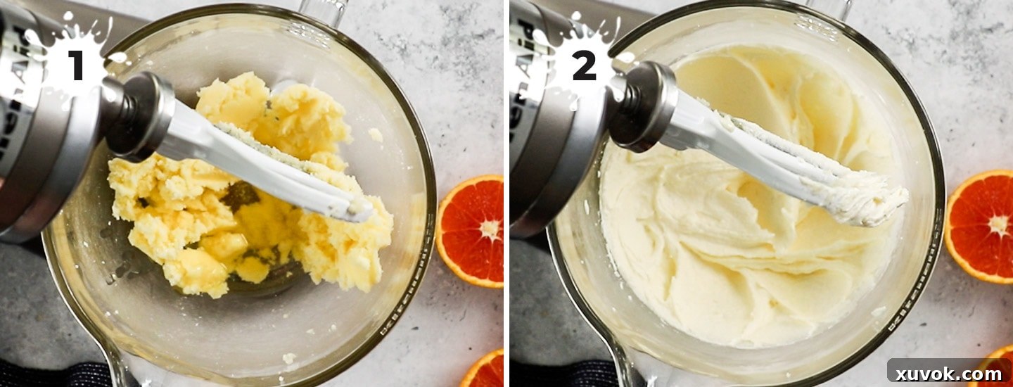Butter, sugar, and oil being creamed together in a stand mixer, creating a light and fluffy mixture.