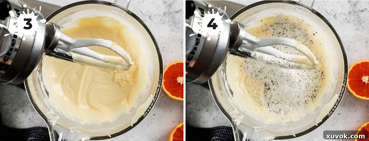 Adding the dry ingredients into the cake batter in a stand mixer, showing the gradual incorporation process.