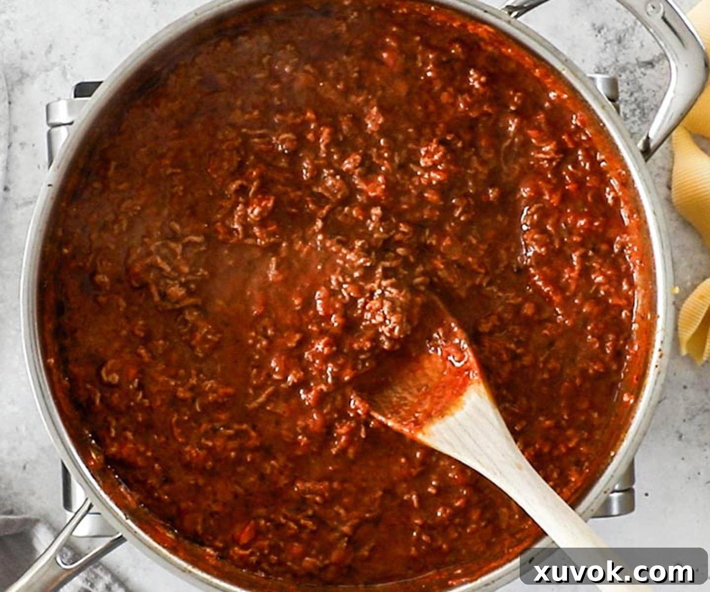 The sauce for the stuffed ricotta shells with meat sauce thickened.