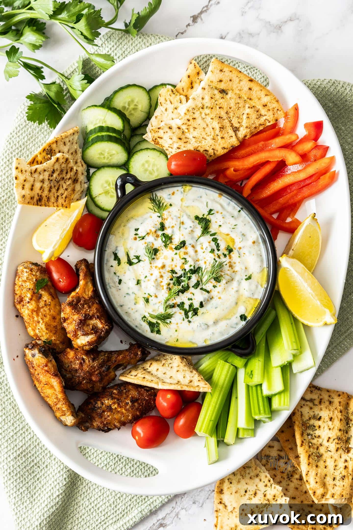 Yogurt dip and crudites on a large dish.