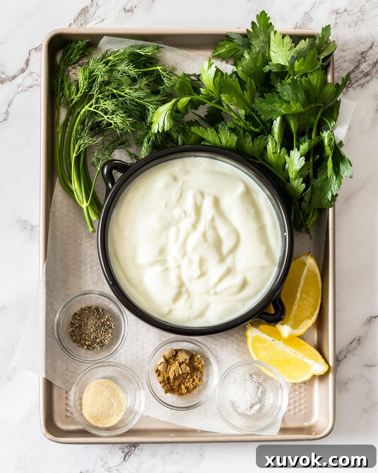 Ingredients for yogurt dip on a baking tray.