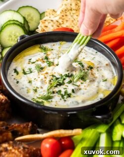 Dipping celery into yogurt dip.