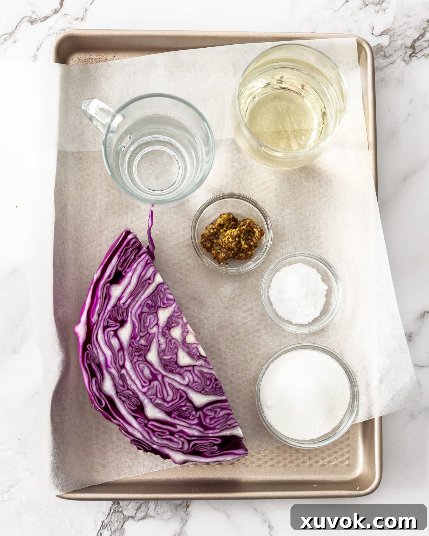 Ingredients for pickled red cabbage, neatly arranged on a baking tray.