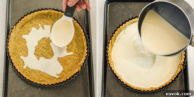 Step 8: Pouring the first layer of panna cotta into the frozen tart shell.