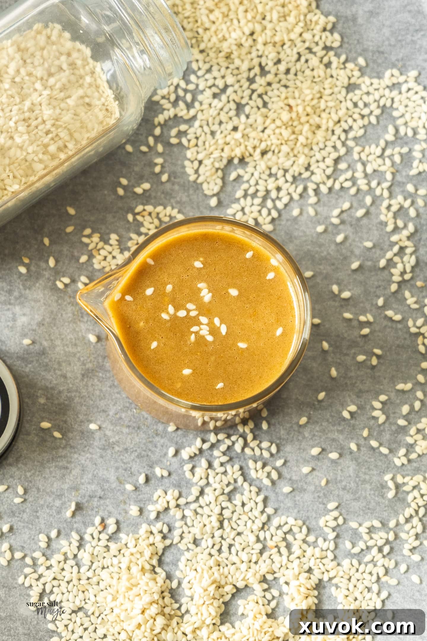 Top down view of goma dressing in a small glass jug.