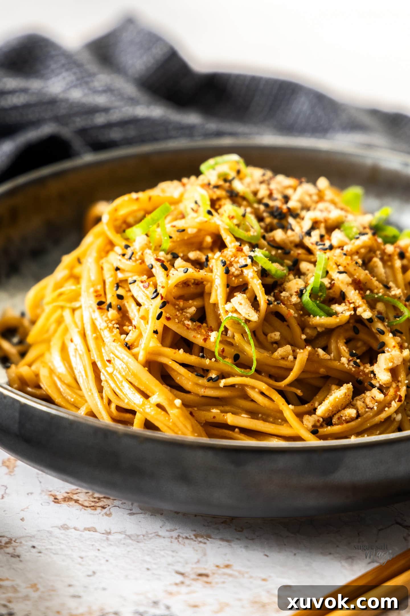 Closeup of noodles in sesame dressing.