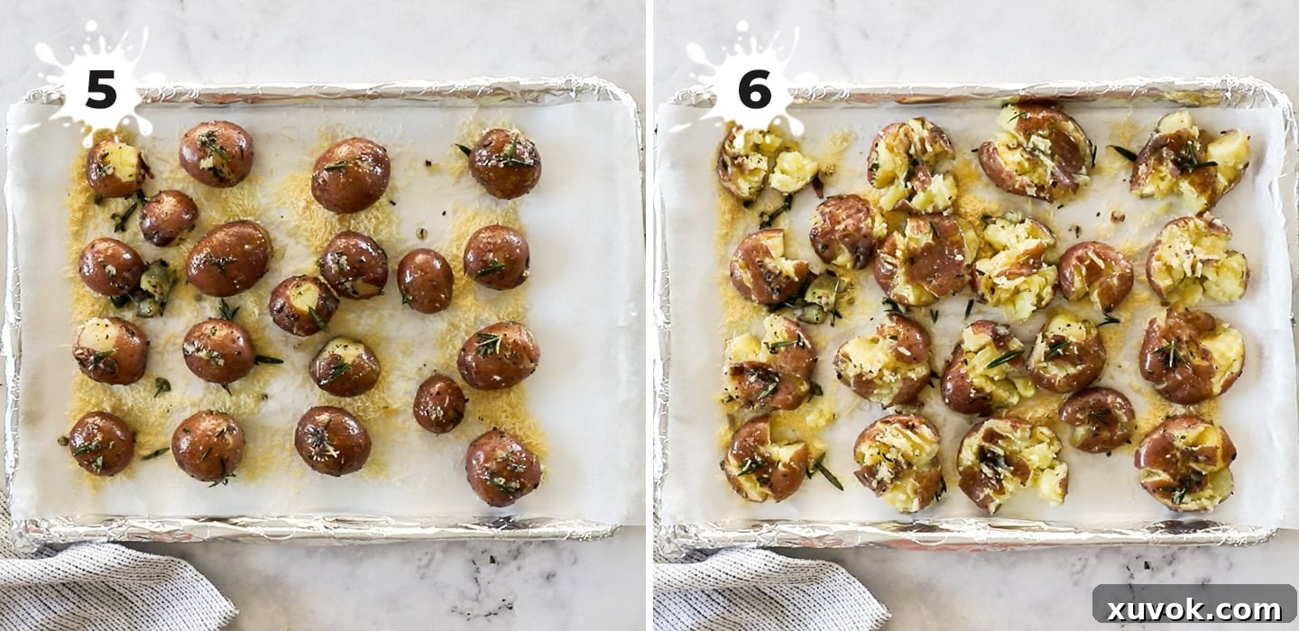 A baking sheet covered with smashed potatoes, ready to be baked to golden perfection.