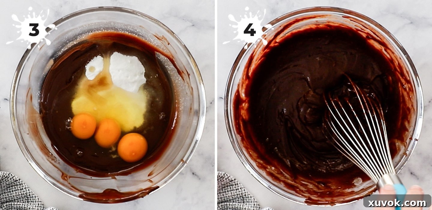 Eggs and sugar being whisked into the cooled melted chocolate mixture, creating a smooth, glossy batter.