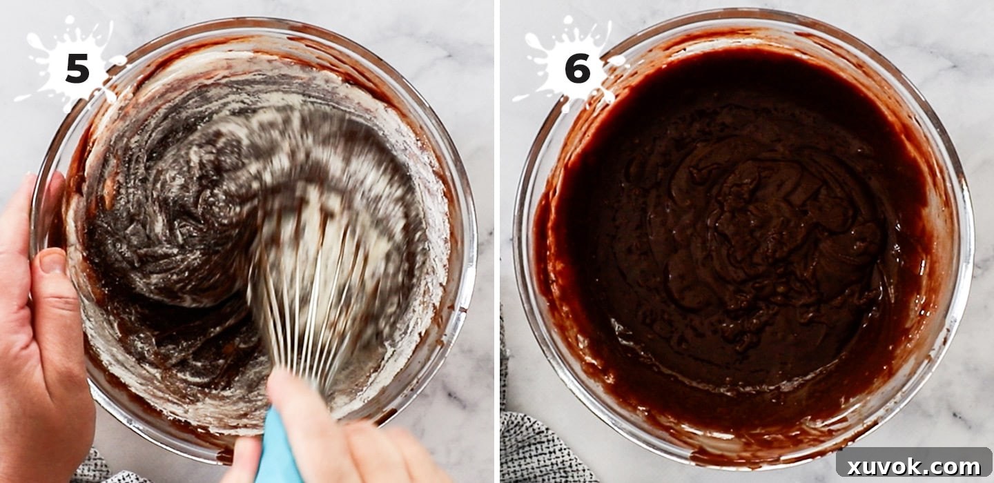 Plain flour being gently whisked into the chocolate batter, ensuring no lumps and a smooth consistency.