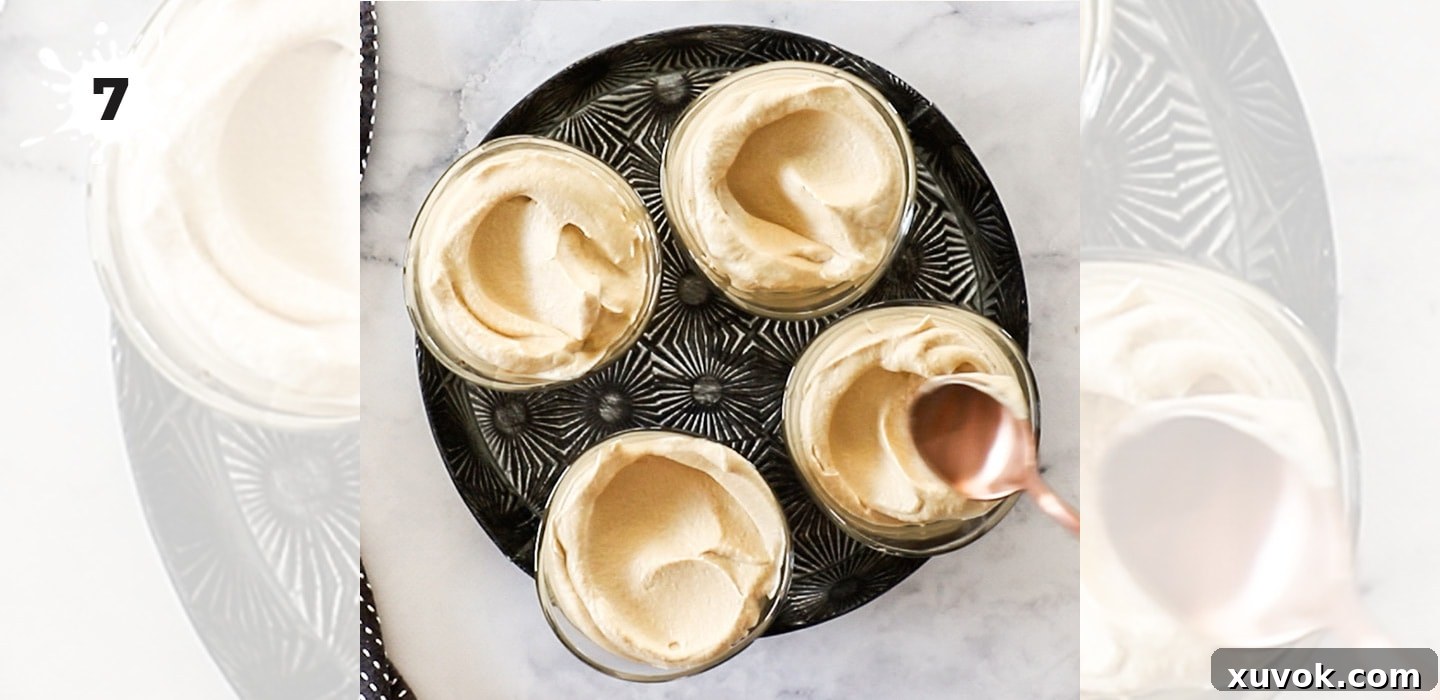 Individual dessert glasses being carefully filled with the smooth and airy coffee mousse mixture, prepared for chilling.