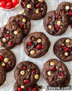 A batch of black forest cookies on a sheet of baking paper.