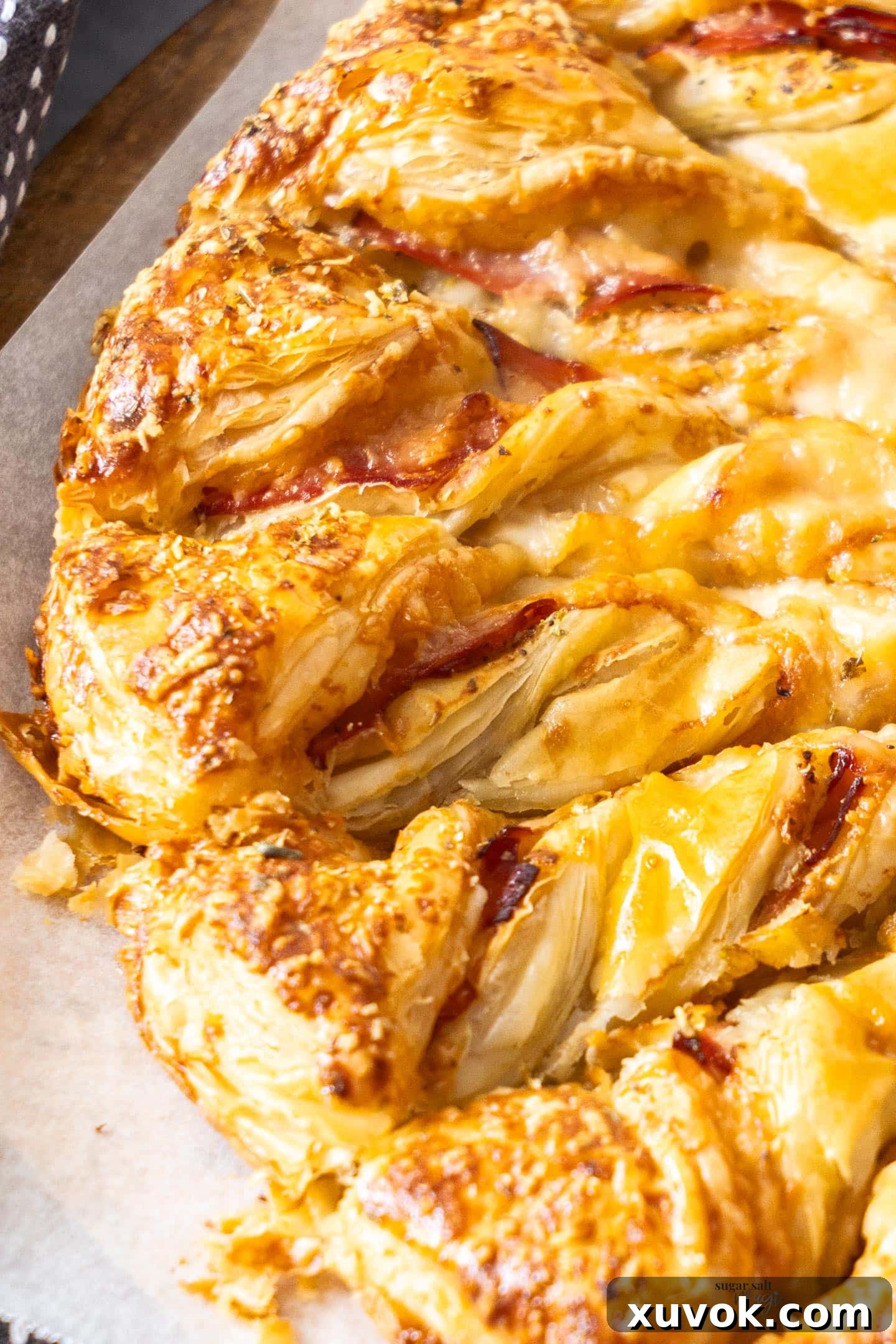 Closeup of one strand or ray of the ham and cheese tarte soleil, ready to be pulled.