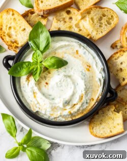 Top down view of ricotta dip in a bowl.