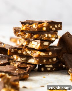 A stack of pieces of christmas crack, showing the crunchy texture.