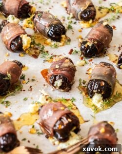 Closeup of one of the wrapped dates, showing the crispy prosciutto and soft date.