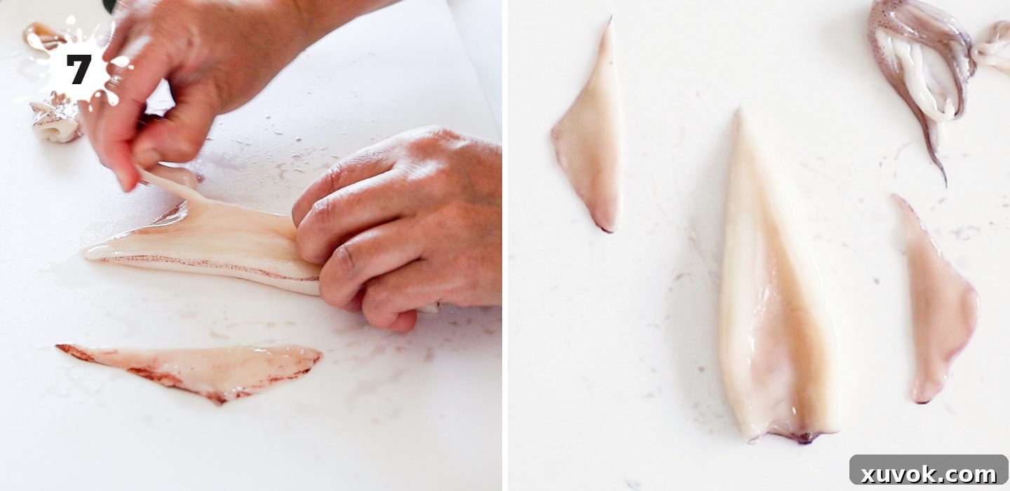 Peeling the triangular wings or fins off the squid mantle.