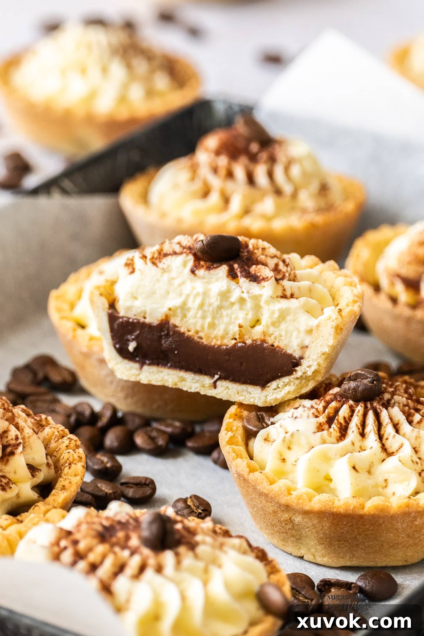 A tiramisu tartlet cut open to show the inside.