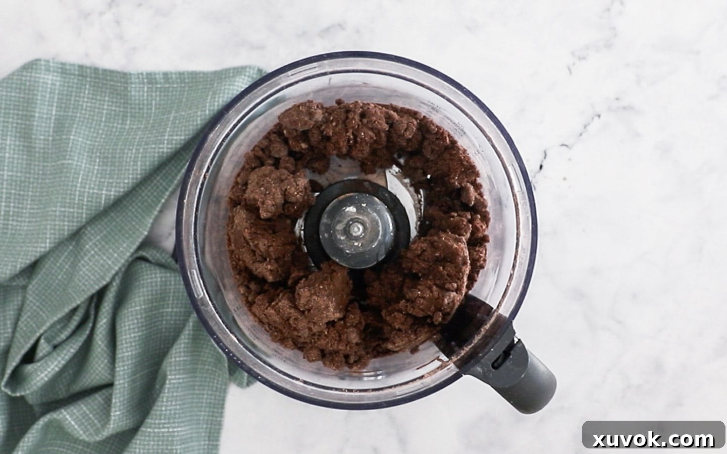 Clumping chocolate dough in a food processor.