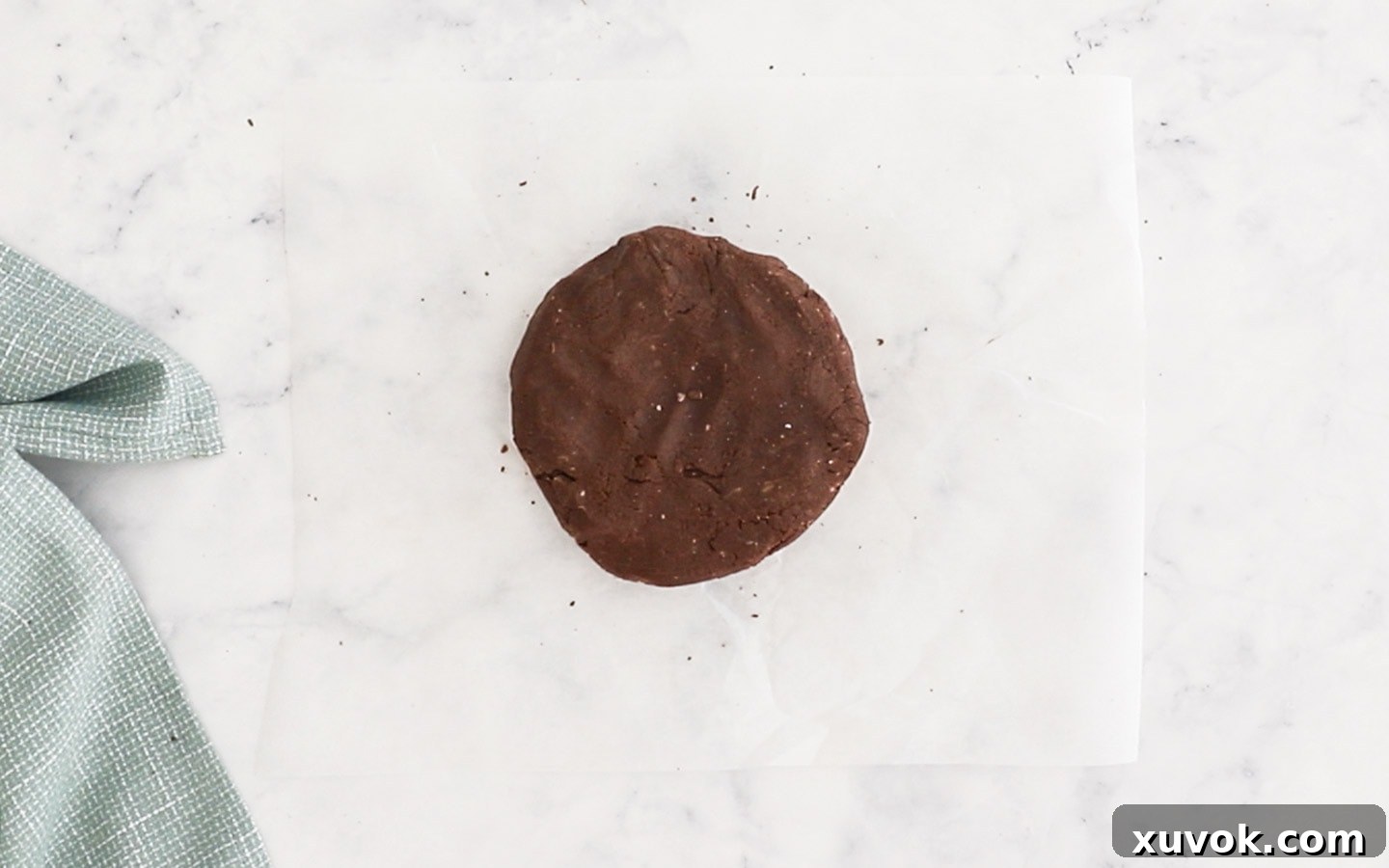The chocolate pastry dough shaped into a disk.