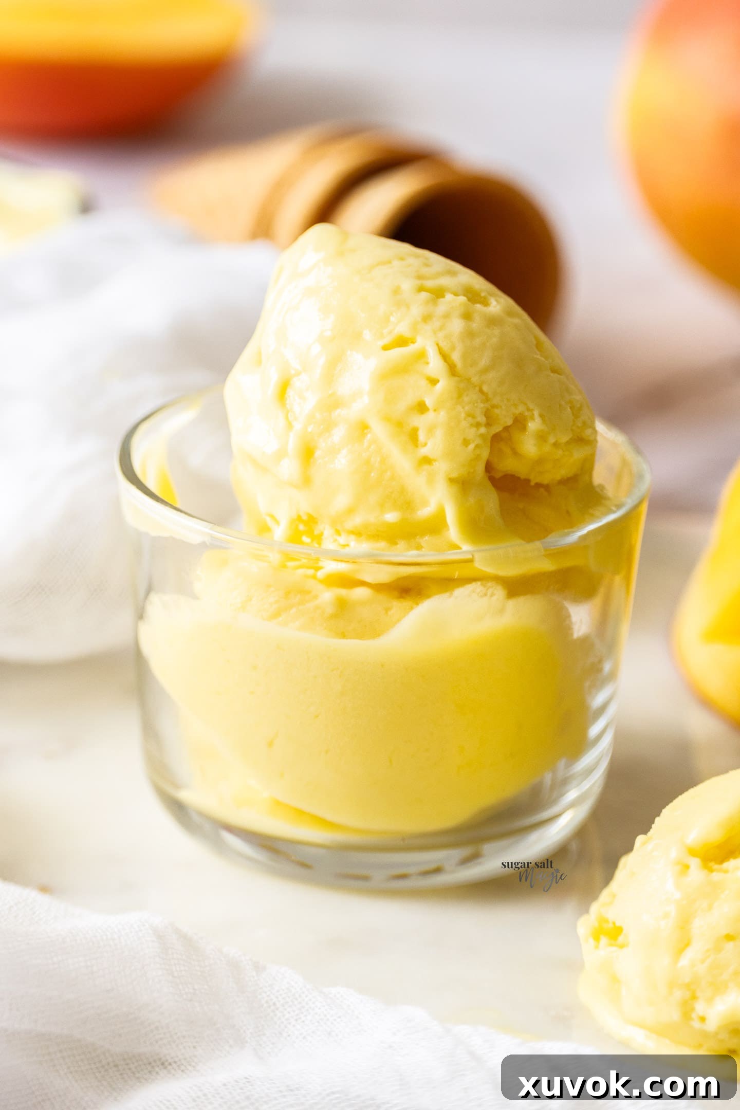Gelato in a glass dish, highlighting its creamy texture.