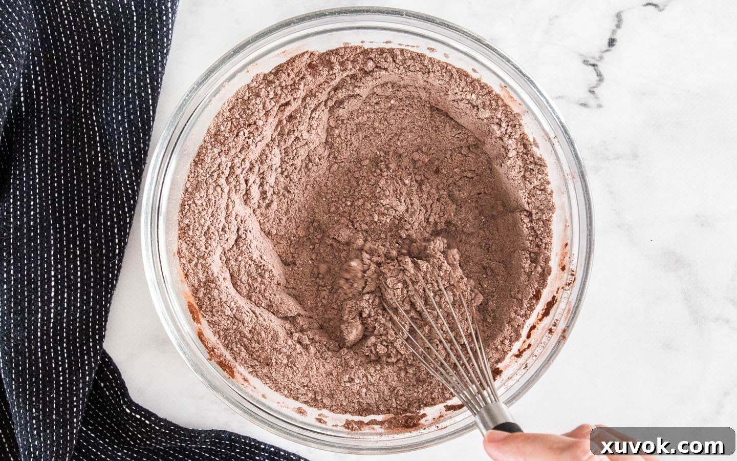 The dry ingredients being whisked in a bowl.