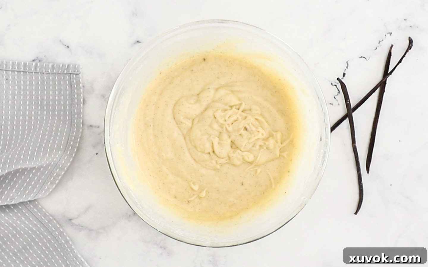 Smooth cupcake batter in a large mixing bowl, ready for baking.