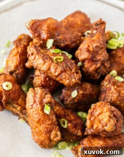 A delectable pile of perfectly fried Chinese chicken wings on a serving plate.