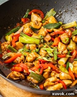 Chicken in oyster sauce in a wok.