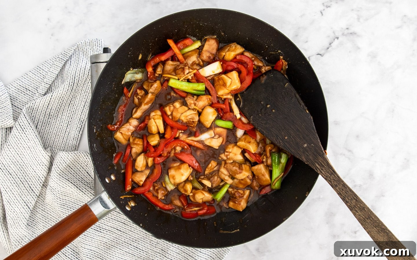 Seared chicken returned to the wok, mingling with the rich oyster sauce.
