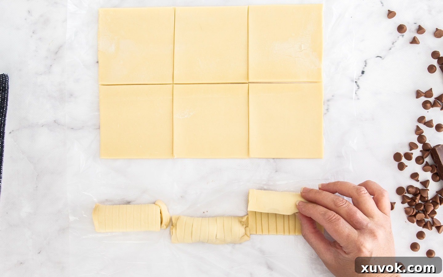 Rolling up the chocolate pastry puffs.