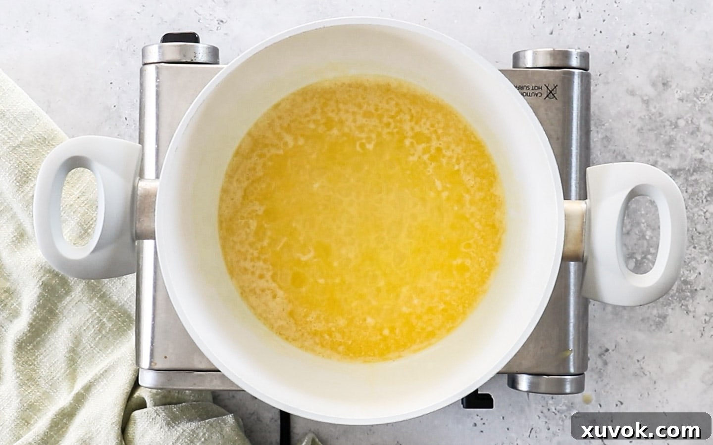 Butter starting to bubble in a pan.