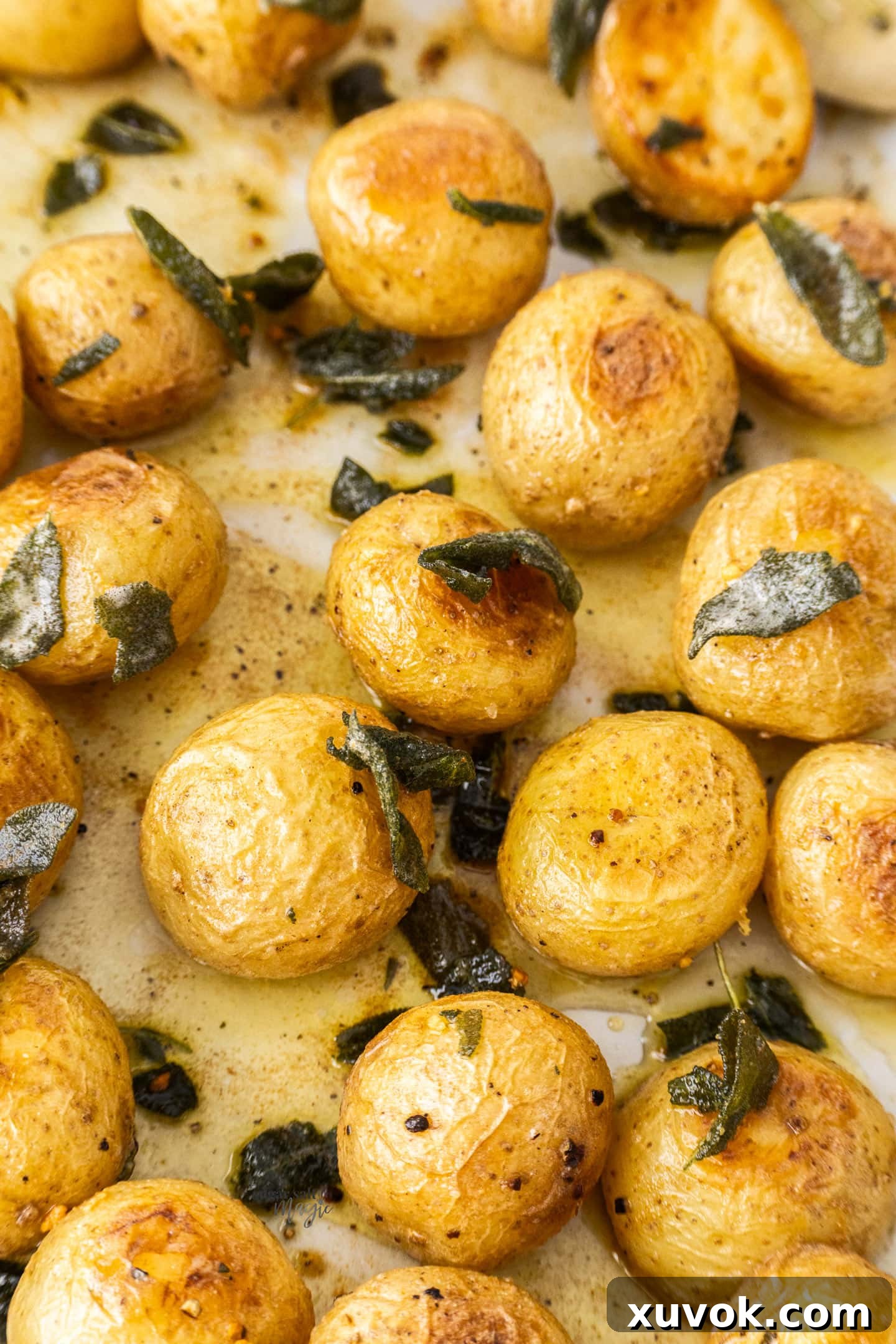 A batch of roasted potatoes dressed with sage butter.