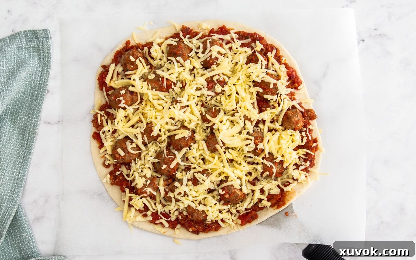 More cheese added to the top.
