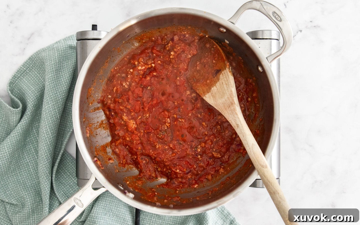 The sauce simmering.