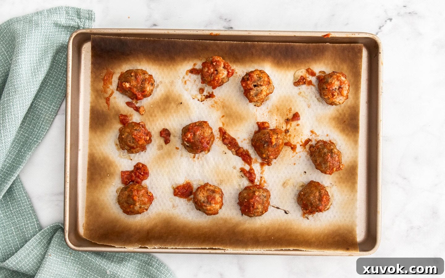 Showing the meatballs coated in meat sauce.