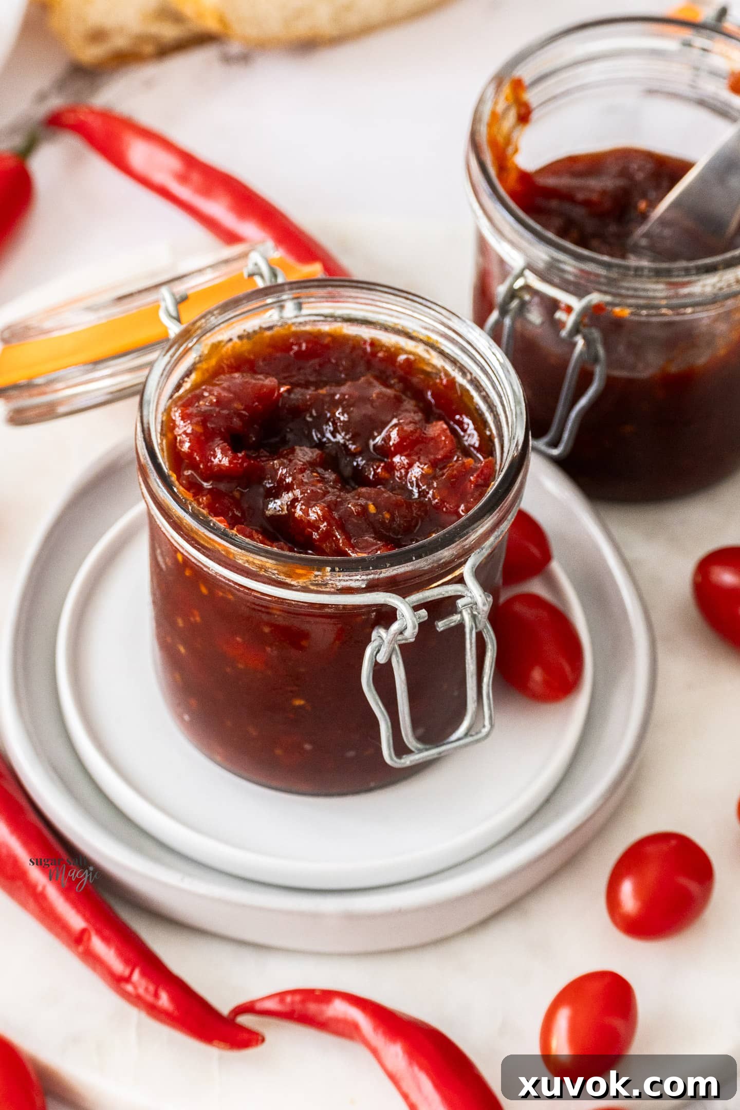 A jar full of tomato and chilli jam.