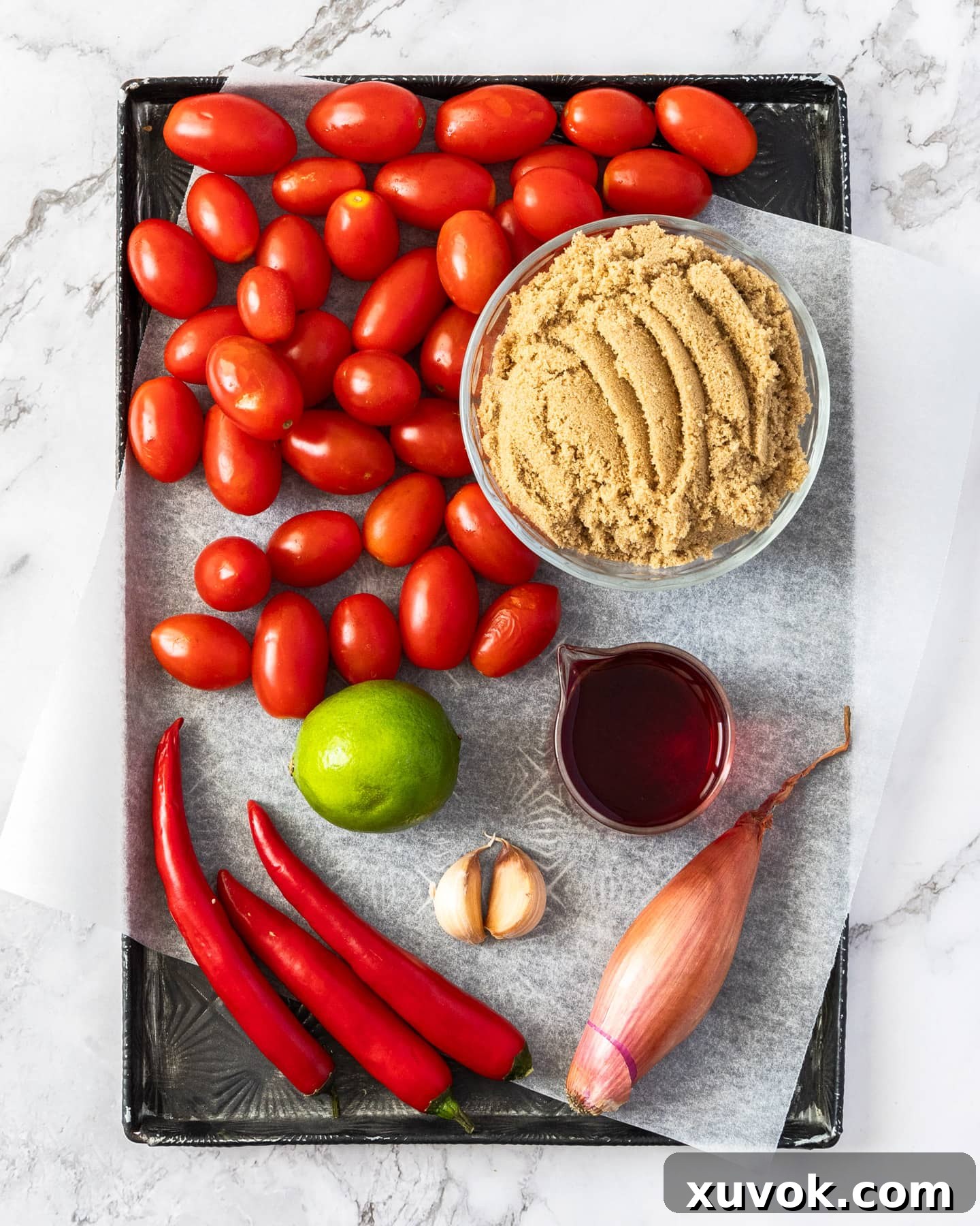 Ingredients for tomato chilli jam on a tray.