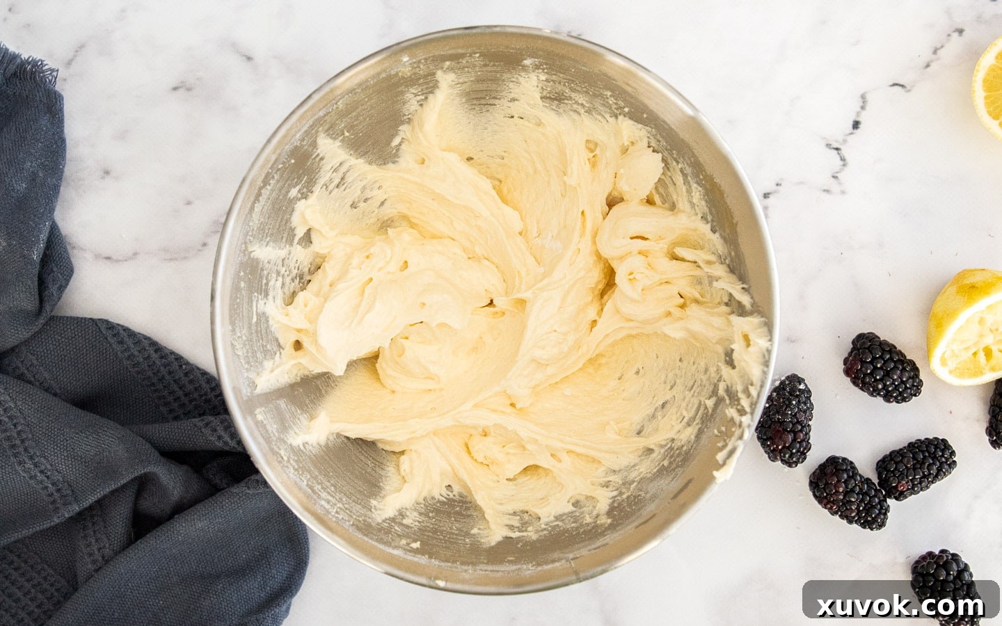 The perfectly whipped mixture of eggs, butter, sugar, and oil, creating a pale and fluffy base for the cake batter.