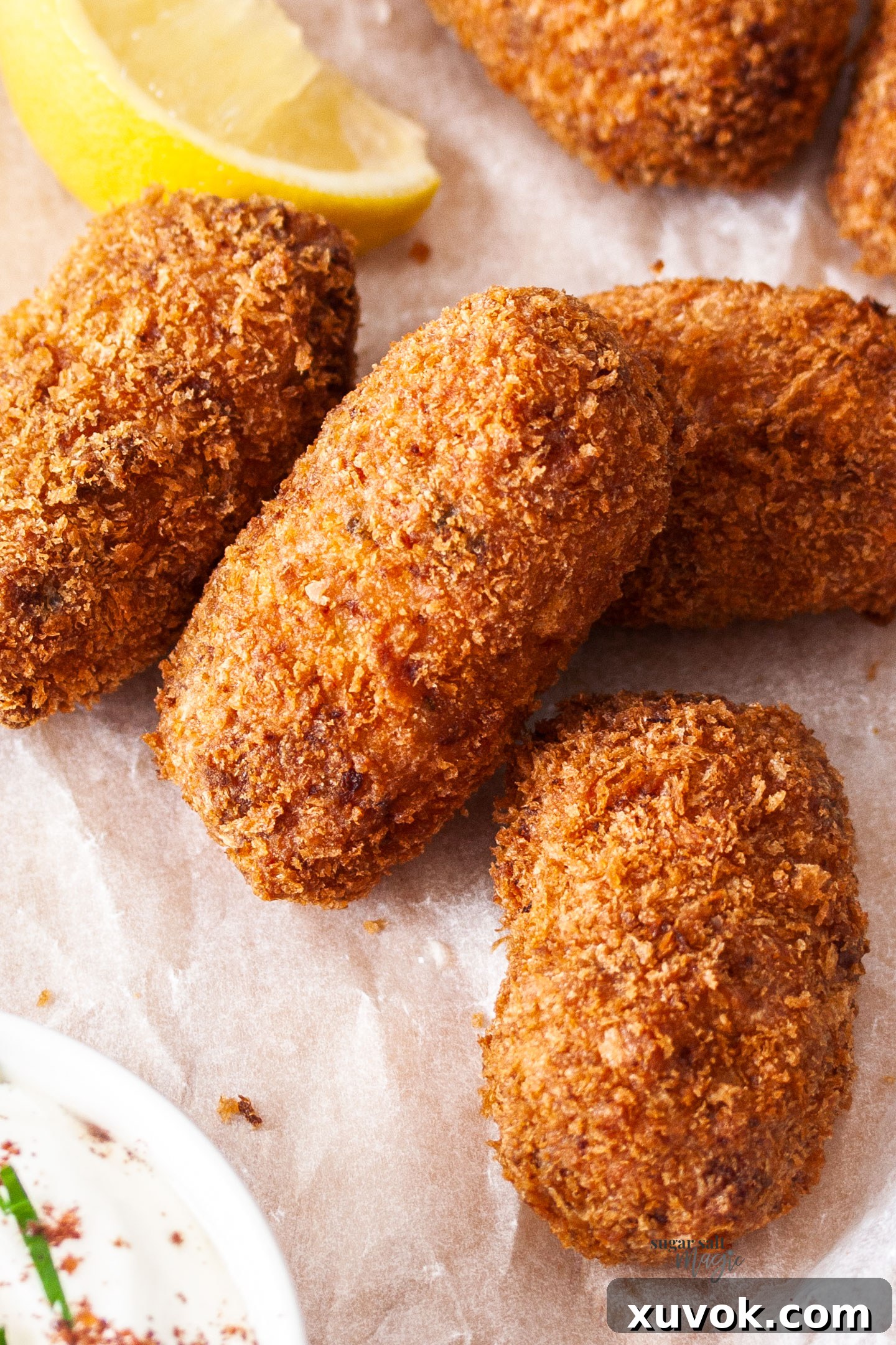Closeup of the outside of the golden-brown pork croquettes, showcasing their crispy texture.