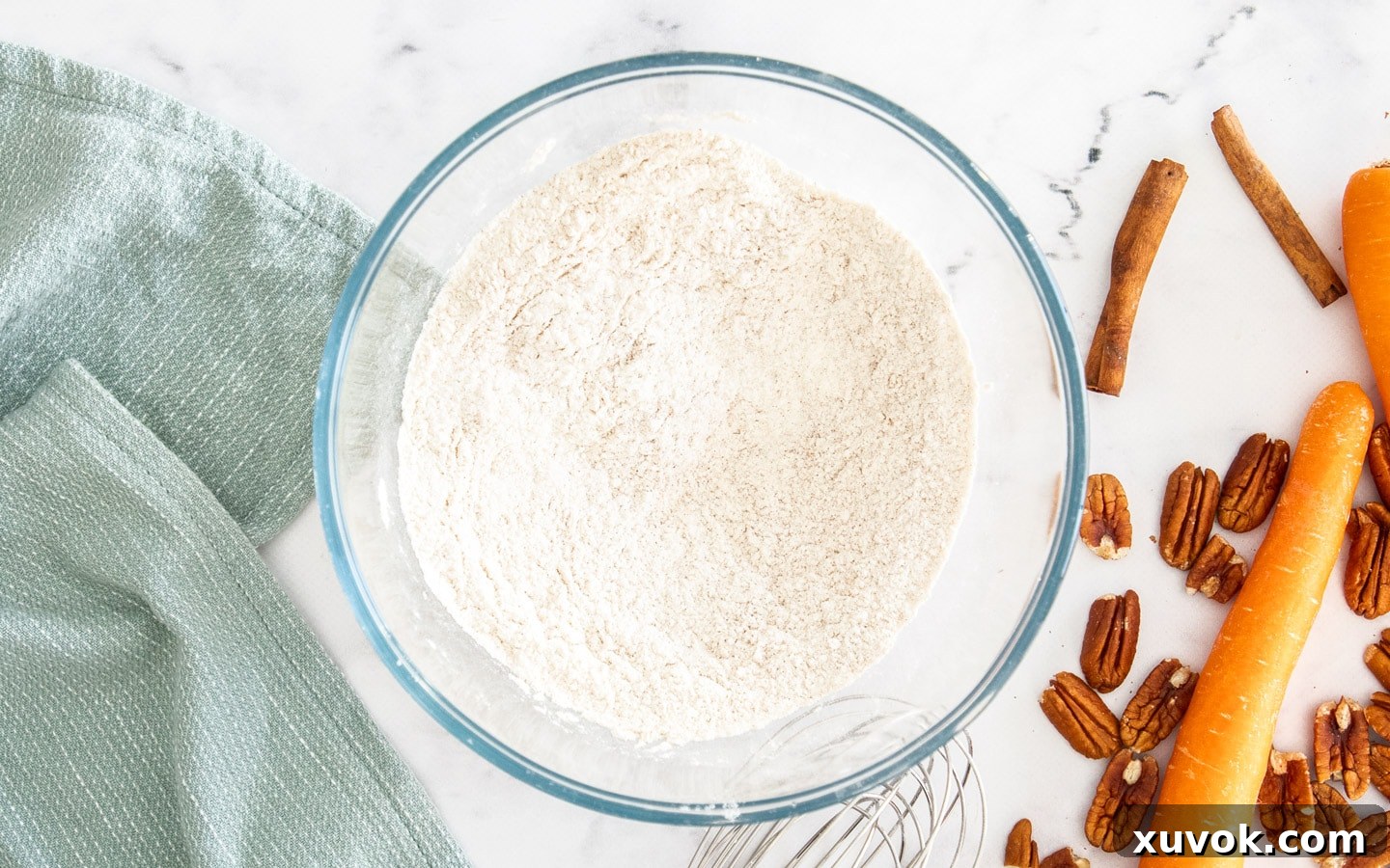 A bowl containing all the dry ingredients – flour, spices, baking powder, and baking soda – perfectly mixed together.