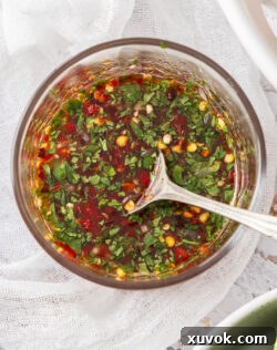 Closeup, top down view of nam jim sauce in a glass bowl.