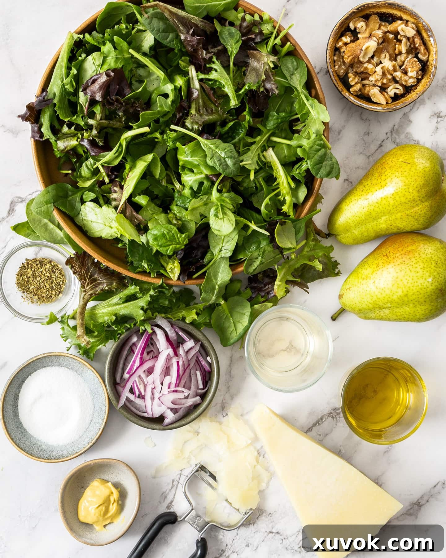 Ingredients for pear walnut salad laid out beautifully.