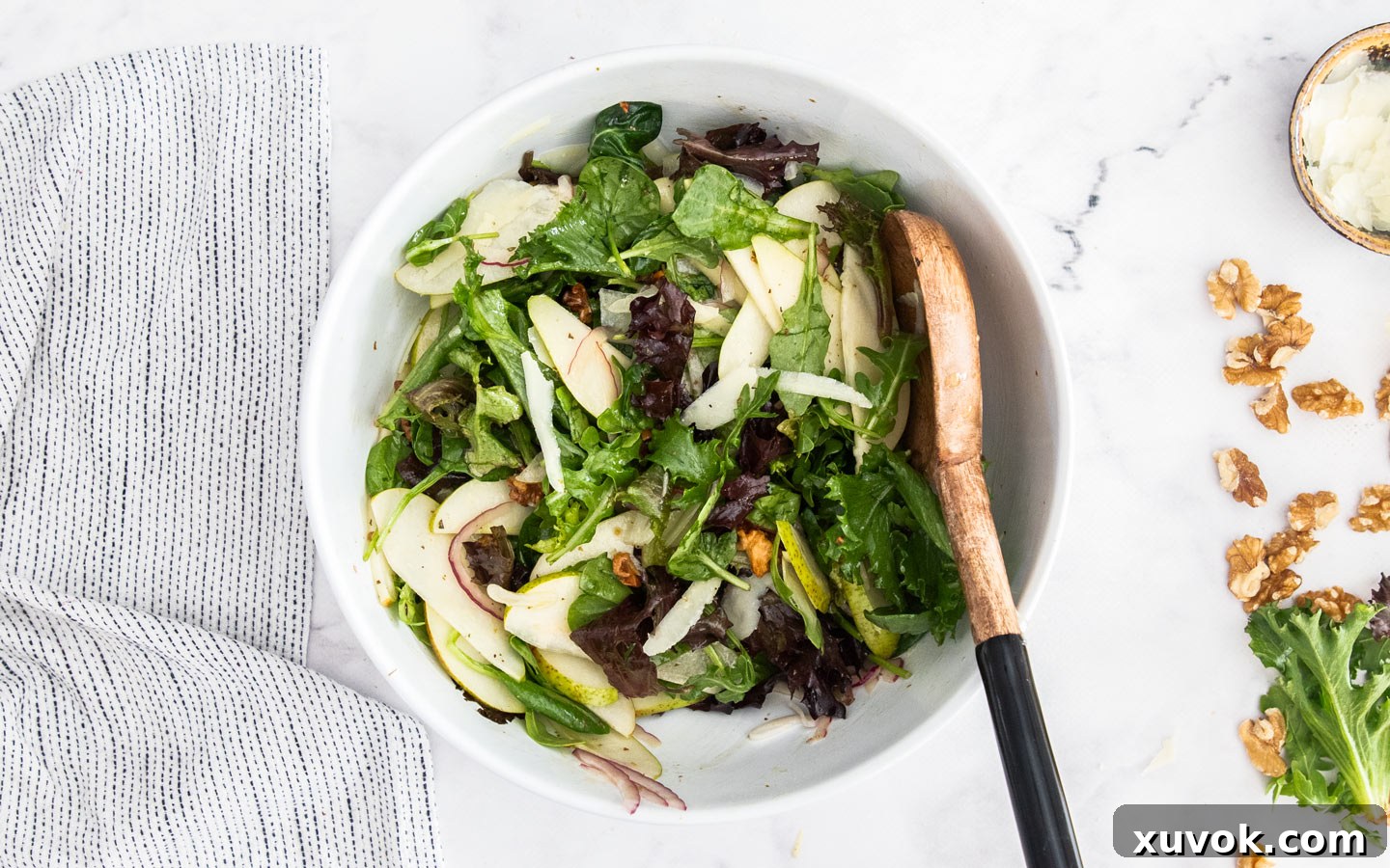 All the salad ingredients added to the bowl, ready for a final toss.