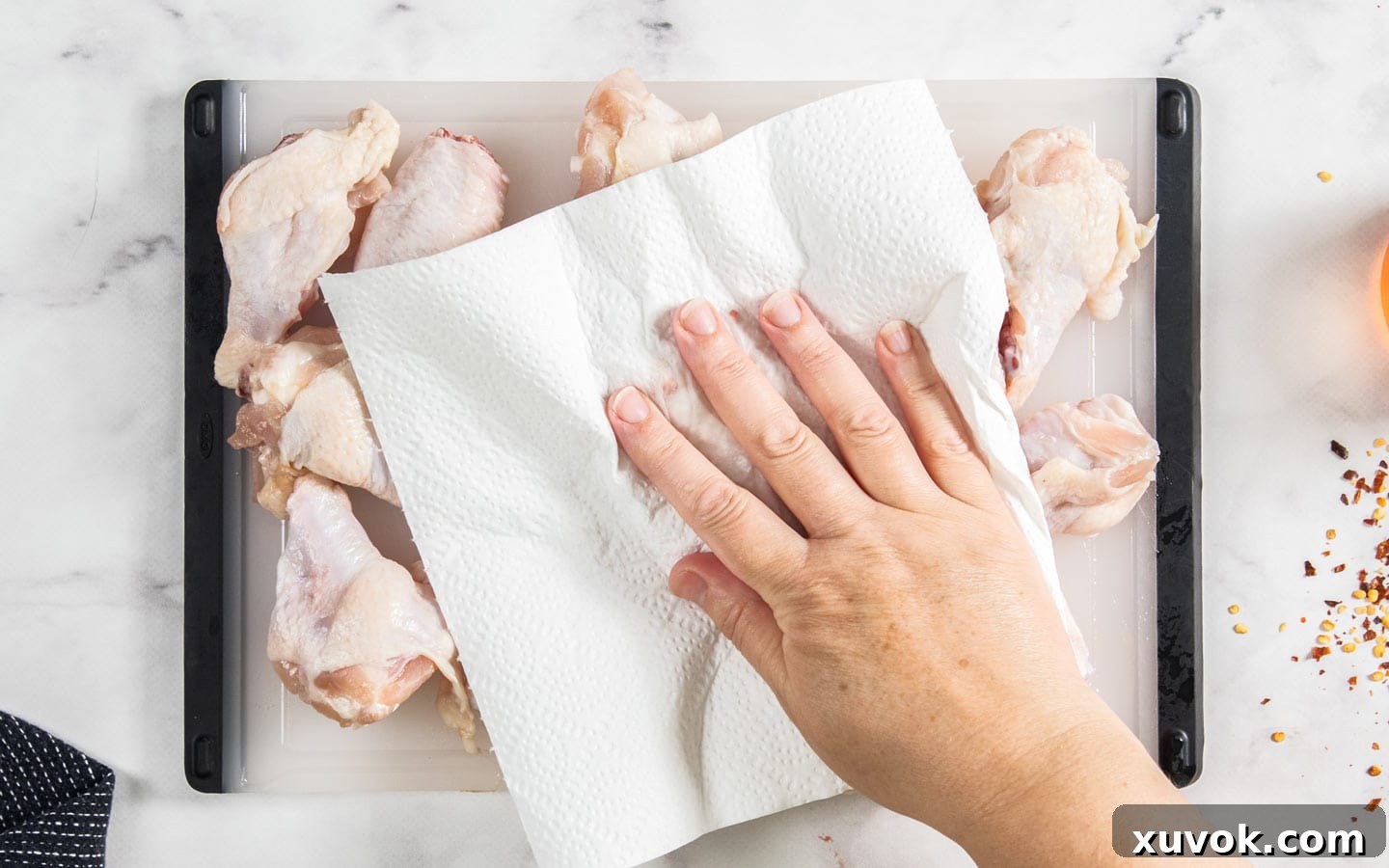 Drying the wings with paper towel.