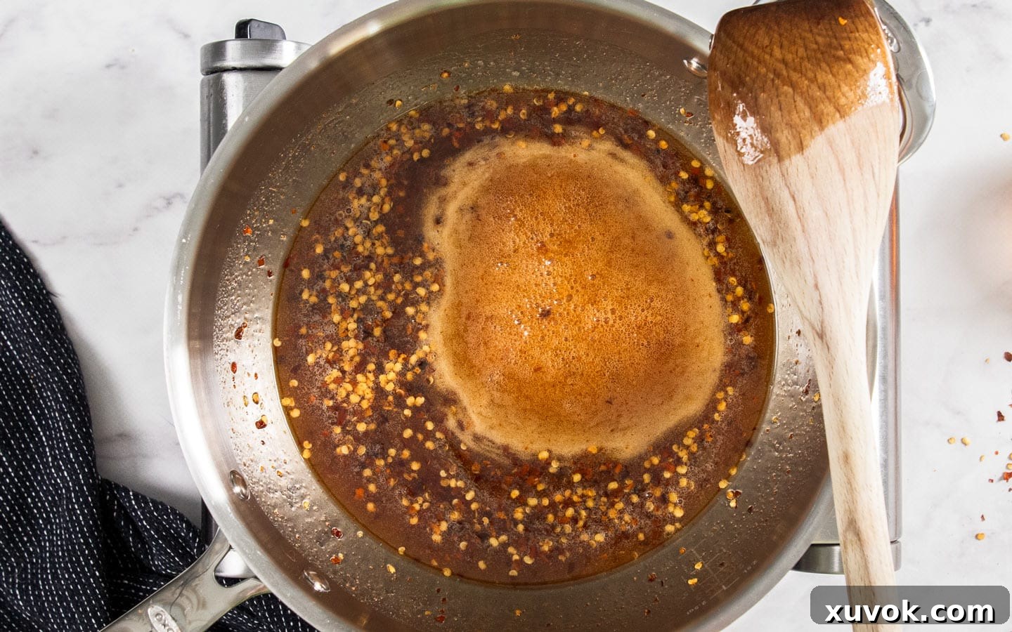 The hot honey mixture simmering in a pan.