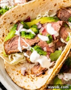 Extreme closeup of the filling inside a steak taco.