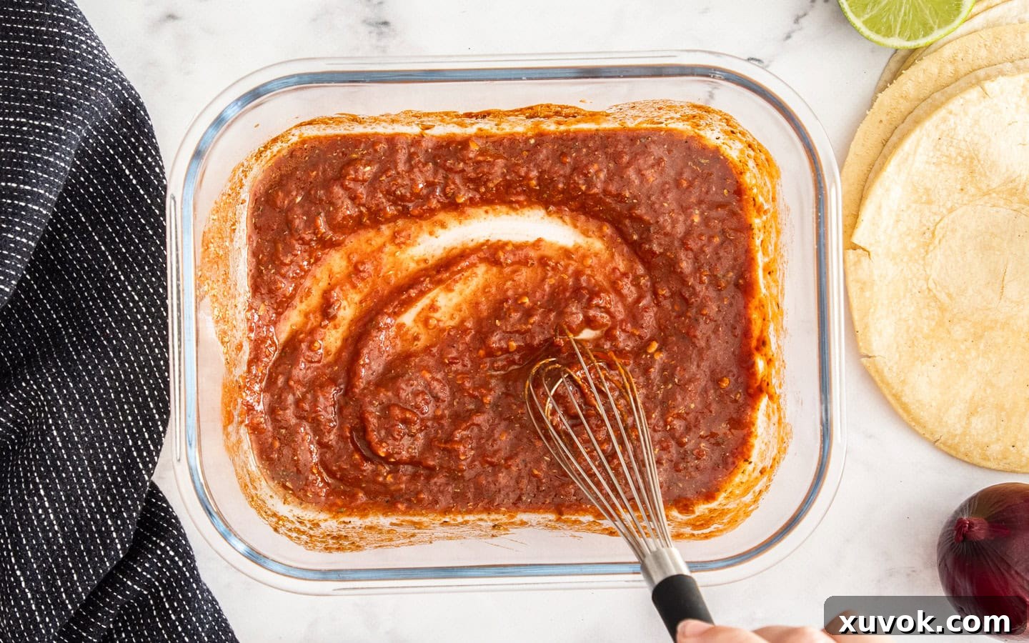 The flank steak marinade in a glass dish.