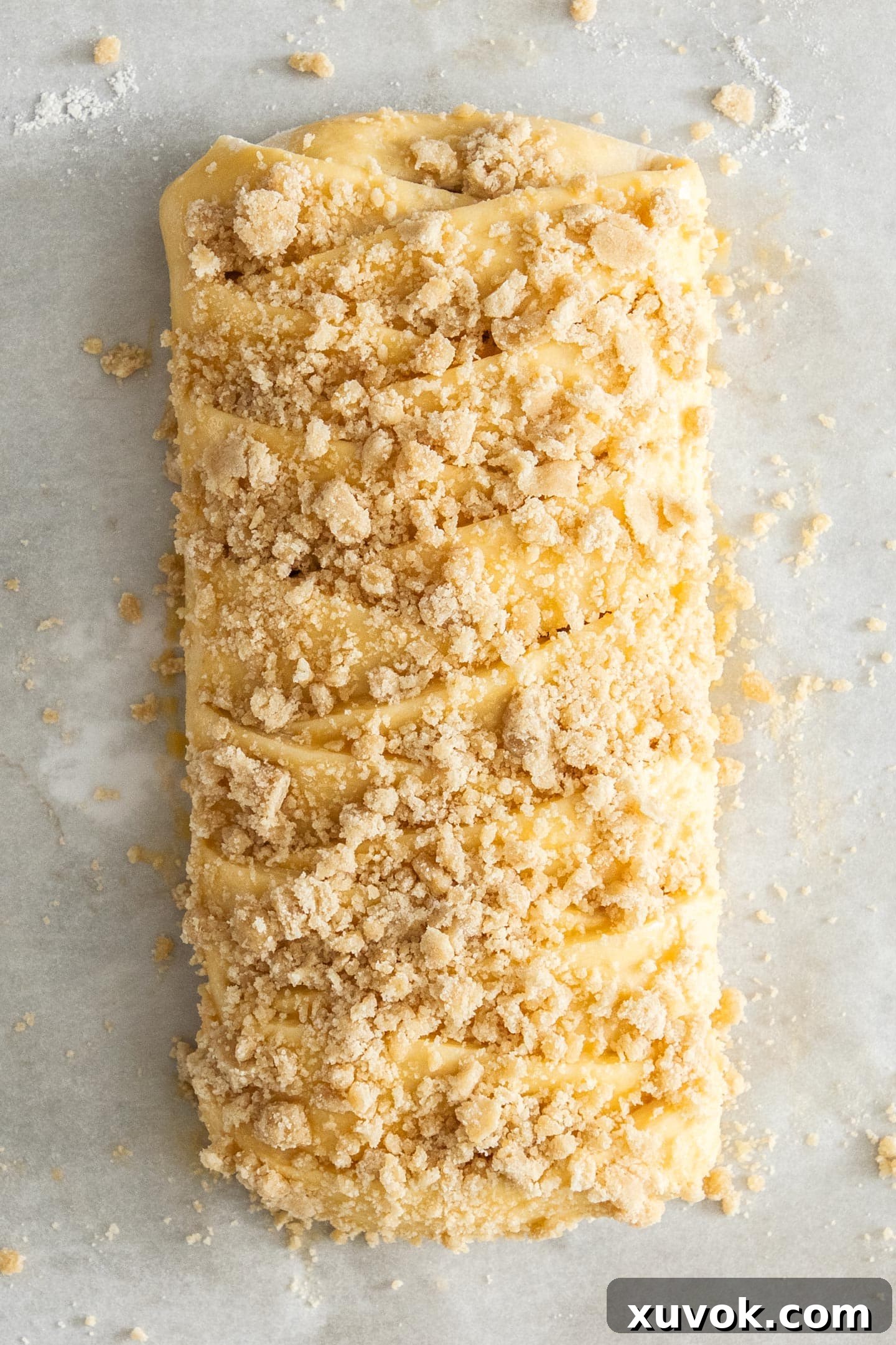 Top down view of a Danish braid topped with streusel.