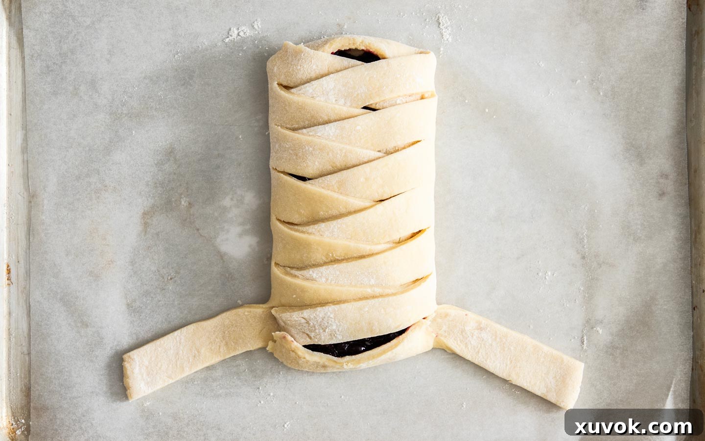 The blueberry Danish braid nearing completion, with only the last two side strips left to be folded over the top.